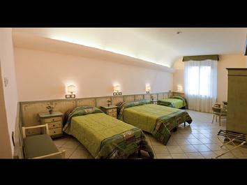 Sample guest room at Casa Santa margherita. Room sizes vary.